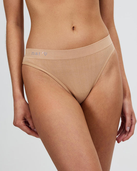 Beige cheeky G-string thong underwear with lace-trim look at leg openings