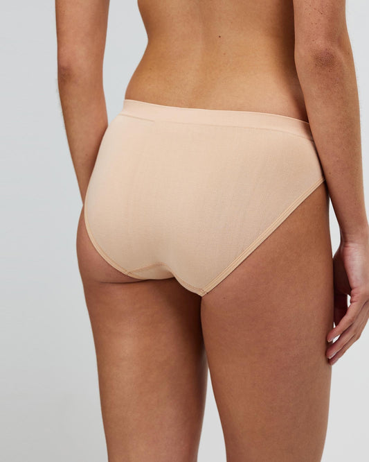 Bone bikini brief back view, seamless cut, moderate coverage