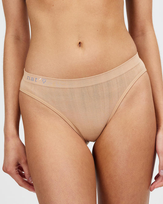 Light tan seamless brief underwear with elastic waistband and moderate coverage