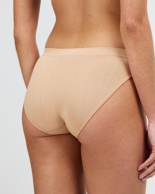 Light tan seamless brief with low-rise cut and high leg line
