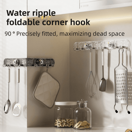 Corner suction cup hook rail with translucent body and four metal hooks holding kitchen tools