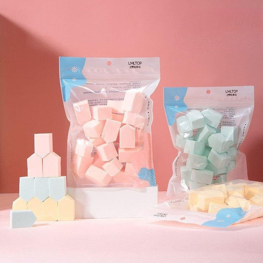 Assorted wedge makeup sponges in pastel colors, packaged set of small sponge puffs