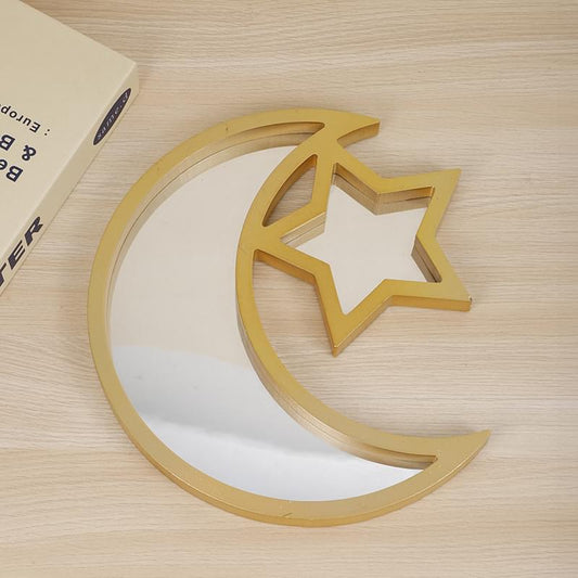 Gold mirrored moon serving tray with star cutout, crescent and star shapes.