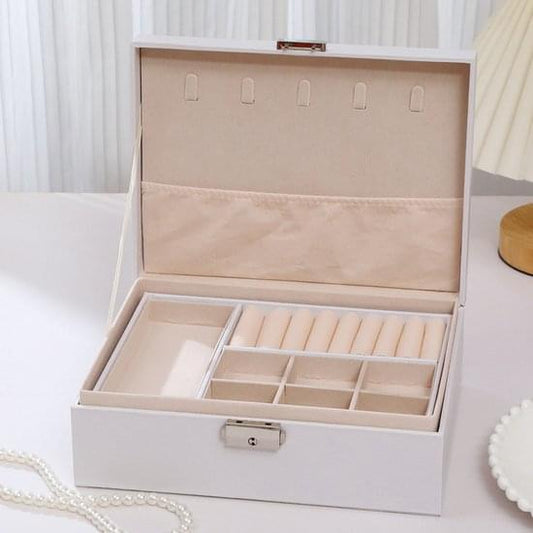 White two-tier jewelry box with lock, open lid, and divided compartments