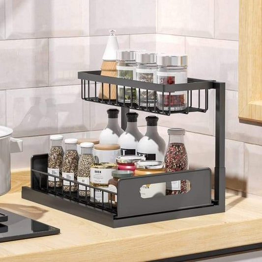 Black 2-tier spice storage rack with wire baskets and front handle on lower tray