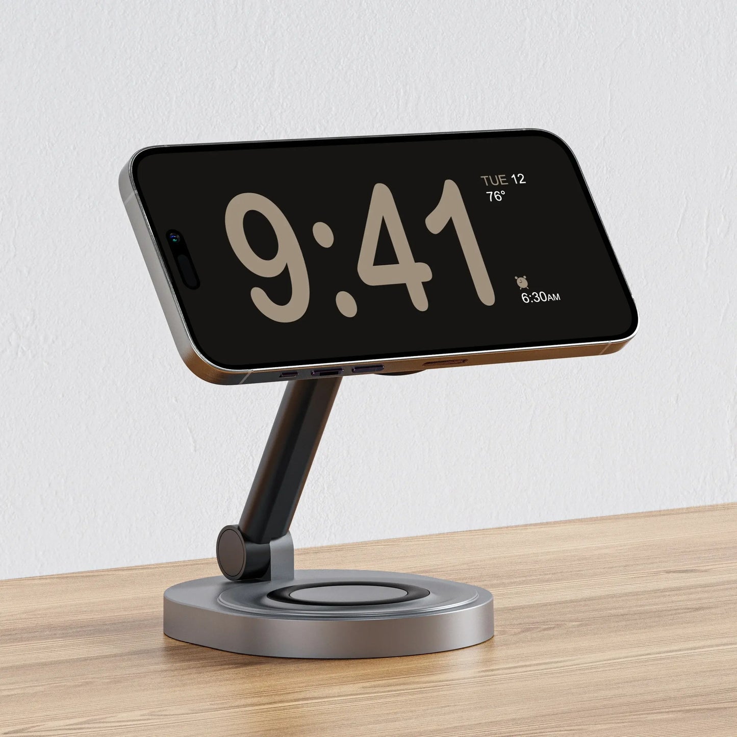 Wireless charging stand with a phone dock and glowing charging pad, gray