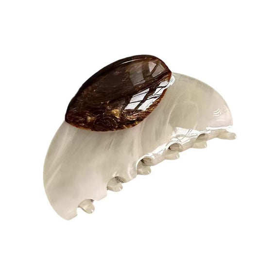 Medium hair claw clip, translucent cream with dark marbled oval patchwork centerpiece.