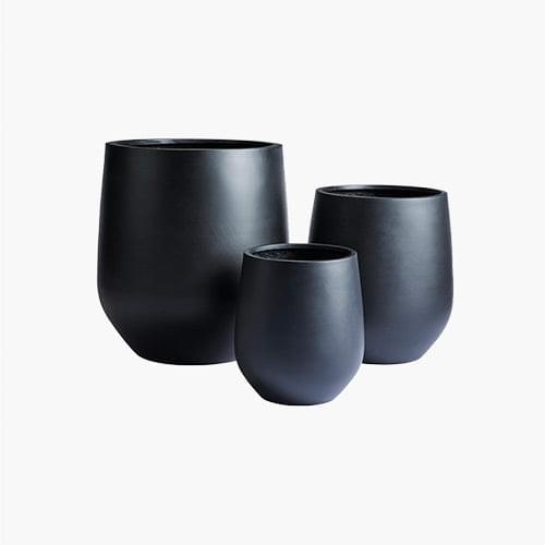 Three cylindrical planters, matte dark charcoal, varying sizes