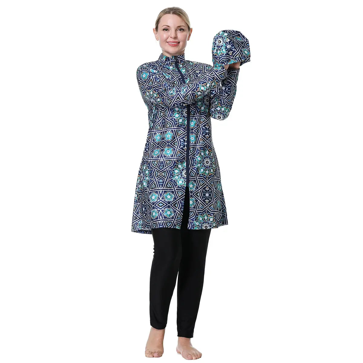 Hooded swim cover-up tunic in blue geometric print with long sleeves and black leggings.