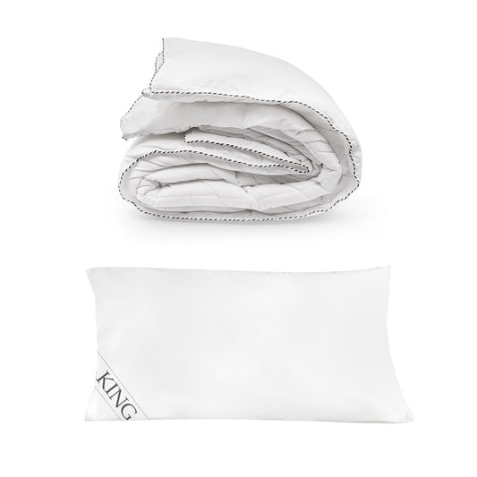 Folded white quilt with matching white KING pillow