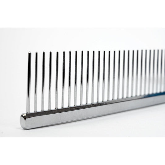 Metal poodle comb close-up with dark base and upright pins