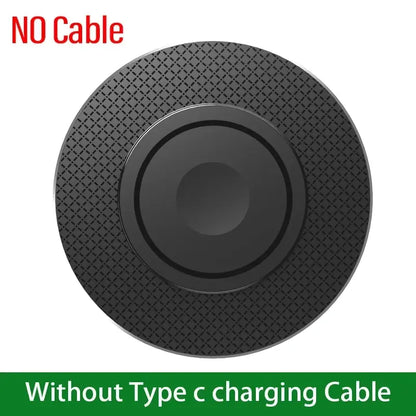 Black wireless charging pad without cable, textured outer ring and centered disc.