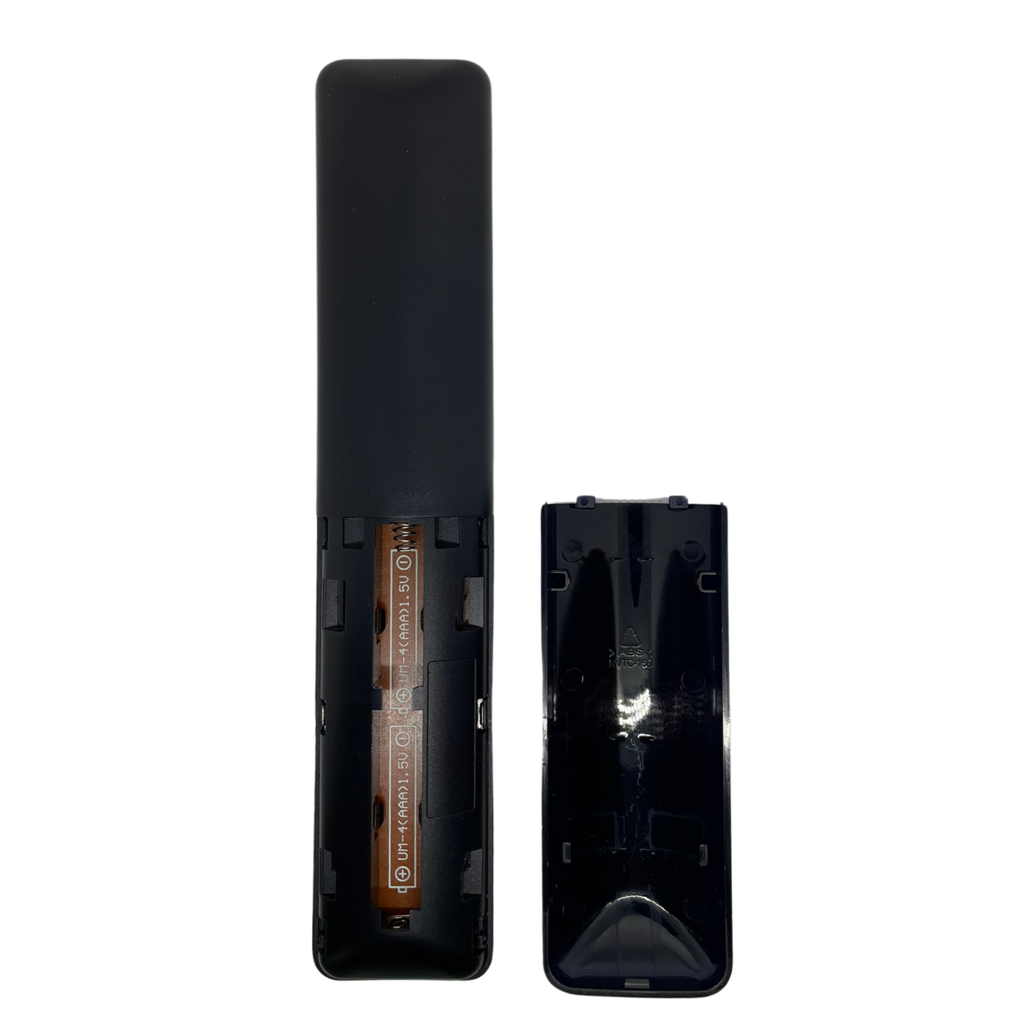 Black TV remote control with back cover open, showing battery compartment