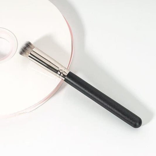 Flat-top concealer brush with black handle and silver ferrule for buffing