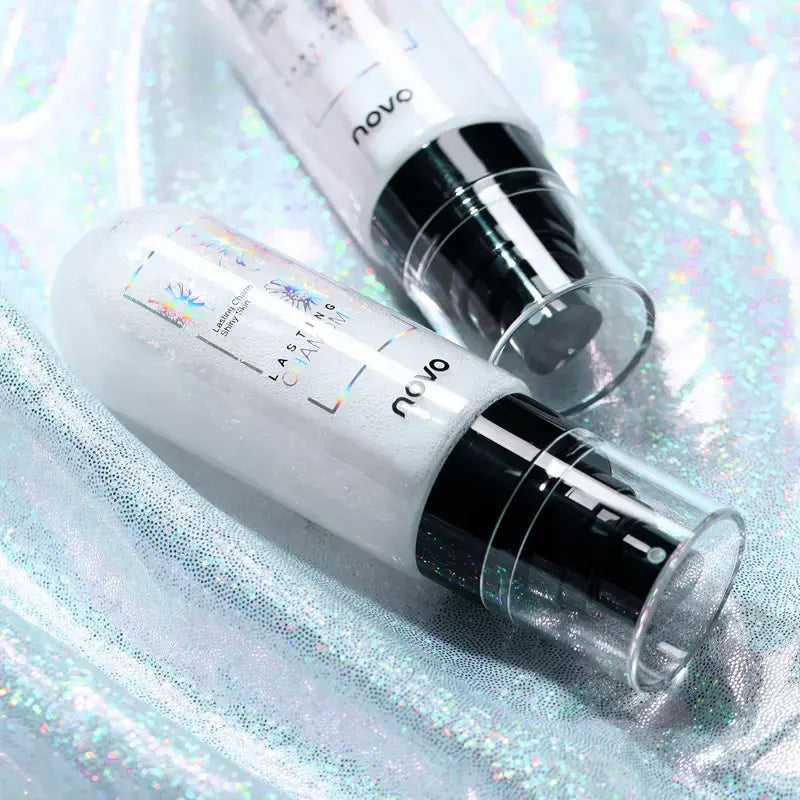 Clear facial mist spray bottles with black pumps, close-up view
