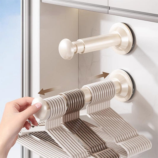 Retractable clothes hanger rack with slatted bar and suction cup wall mounts, beige