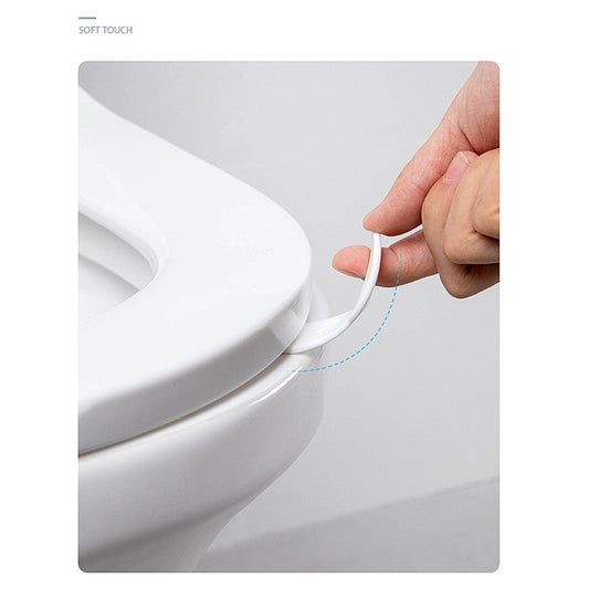 Toilet lid lifter tool in use, white handle lifts the seat edge.
