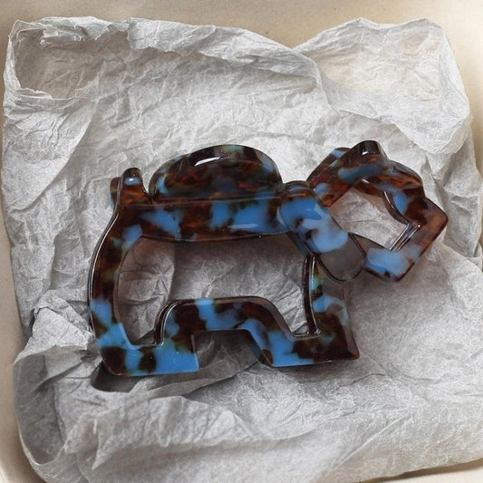 Dark marbled tortoiseshell hair claw with blue and brown swirls, medium size