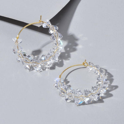 Pair of clear acrylic bead hoop dangle earrings with gold-tone hooks