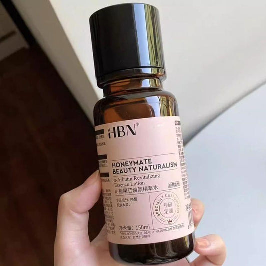 HBN Alpha-Arbutin brightening essence water bottle held in hand, 150 ml