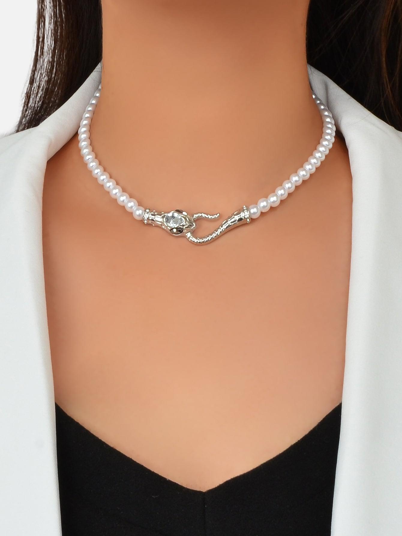 Short pearl bead choker necklace with silver-toned snake clasp and small rhinestone accents