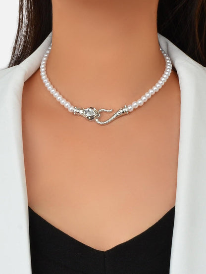 Short pearl bead choker necklace with silver-toned snake clasp and small rhinestone accents