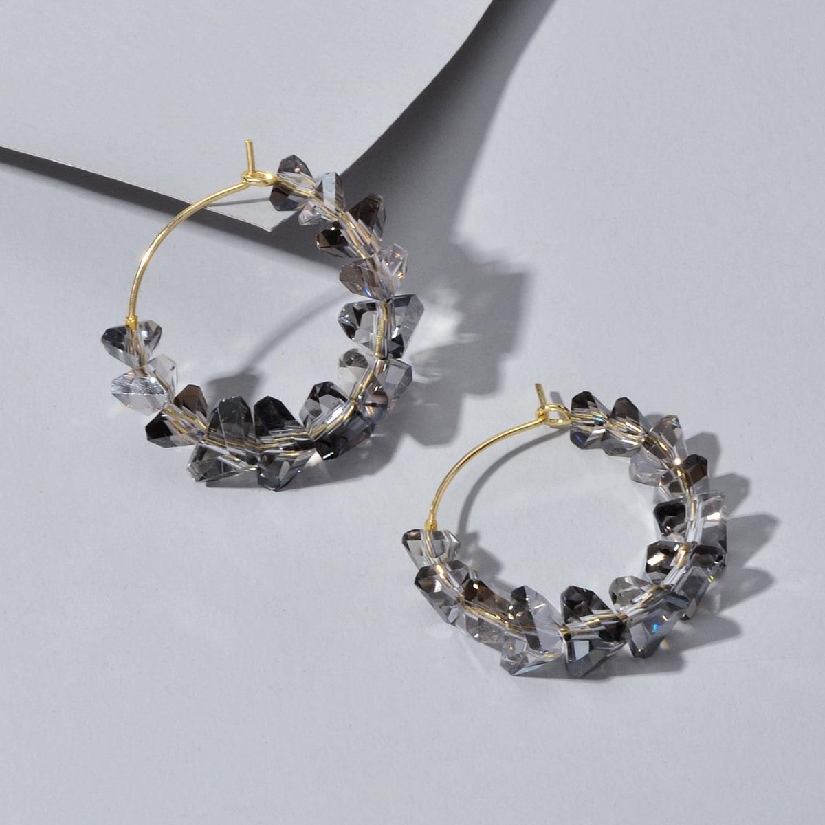 Gold-tone hoop dangle earrings with smoky grey transparent acrylic bead chain