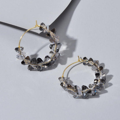 Gold-tone hoop dangle earrings with smoky grey transparent acrylic bead chain