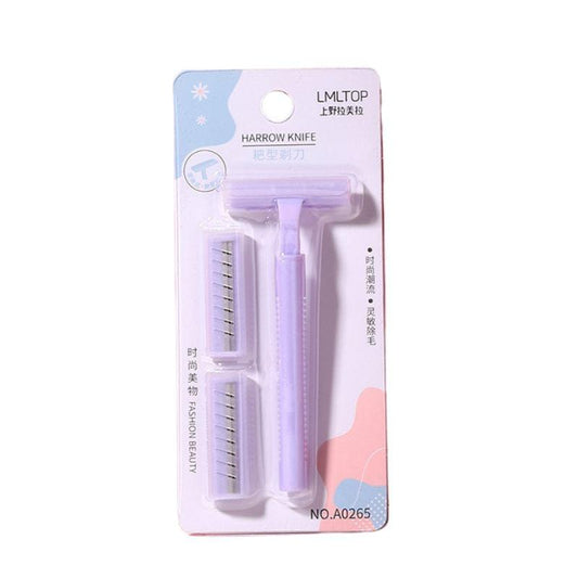 Pink underarm razor with twin blades and two blade cartridges in blister pack