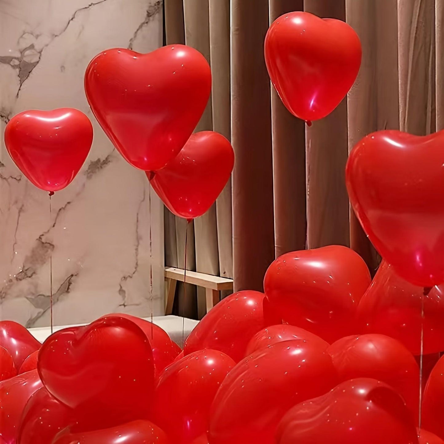 Red heart balloons floating cluster, glossy hearts with strings