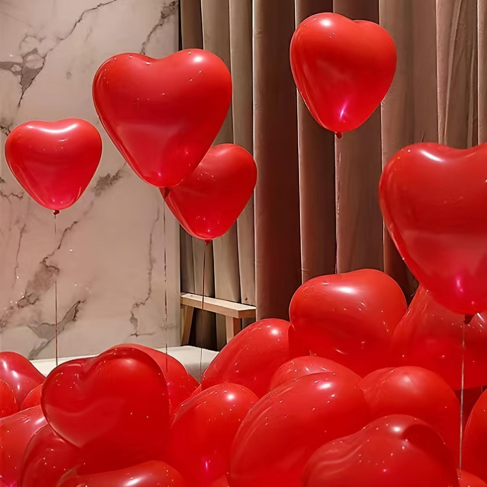 Red heart balloons floating cluster, glossy hearts with strings