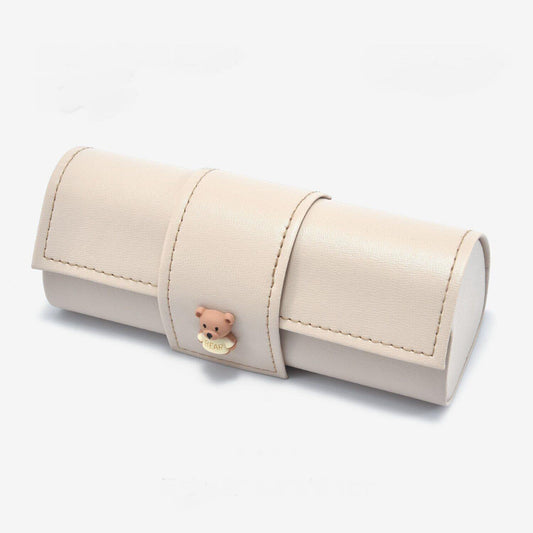 Beige PU leather glasses case with bear charm and flap closure, roll-top style