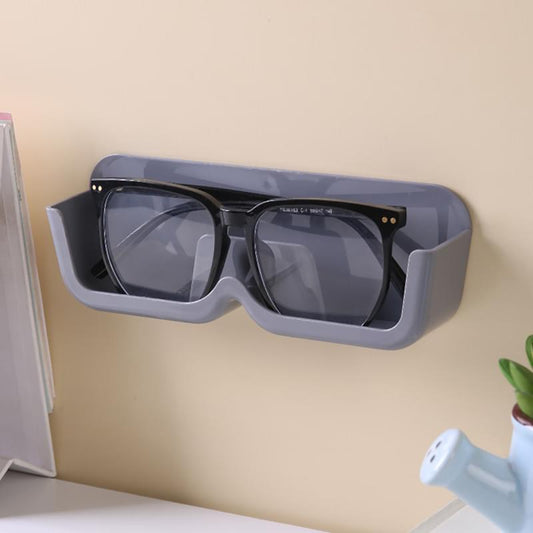 Wall-mounted glasses organizer shelf in gray with black eyeglasses