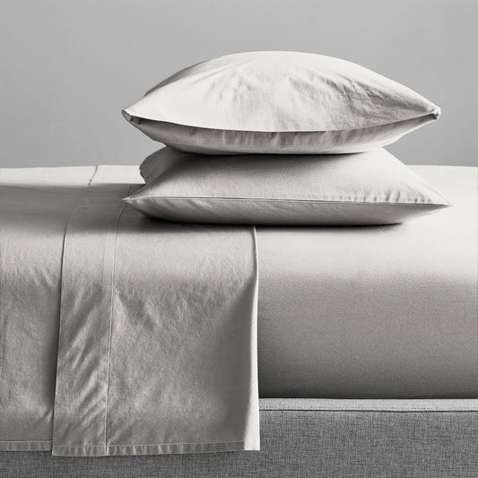 Light gray organic cotton sheet set with pillow shams and flat sheet