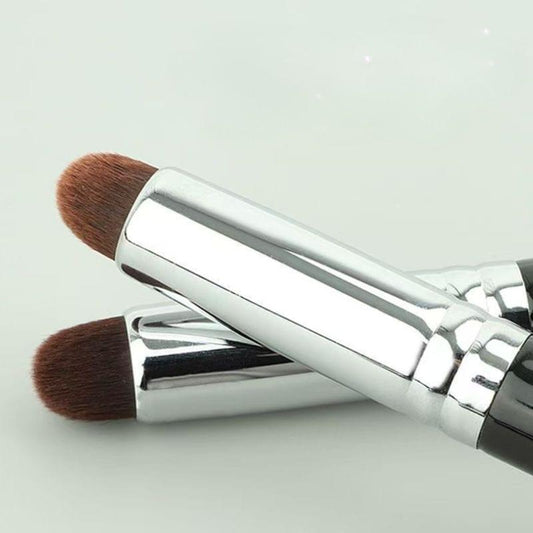 Bullet concealer brush with brown tapered bristles and silver-white handle