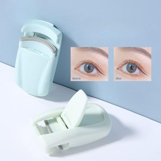 Mint and white mini eyelash curler with open clamp and viewing angle close-up