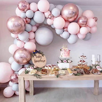 Pink, white, and rose-gold balloon garland arch kit with round metallic and matte balloons