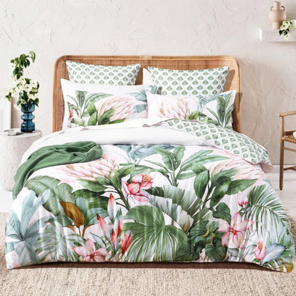 Kids quilt cover set on bed: pink and green tropical floral duvet with coordinating pillows
