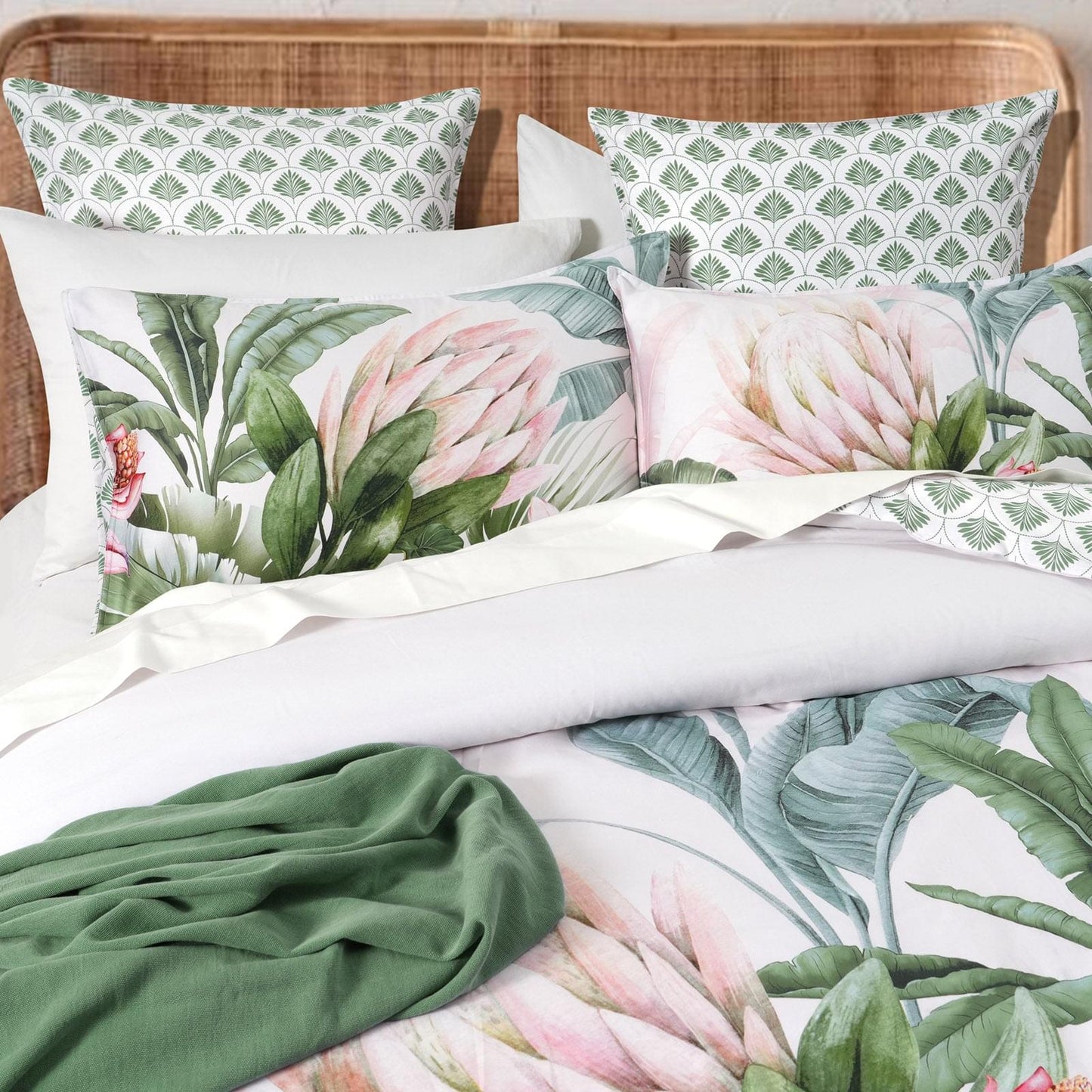 Kids quilt cover set detail: white fabric with green trellis pattern and tropical leaves