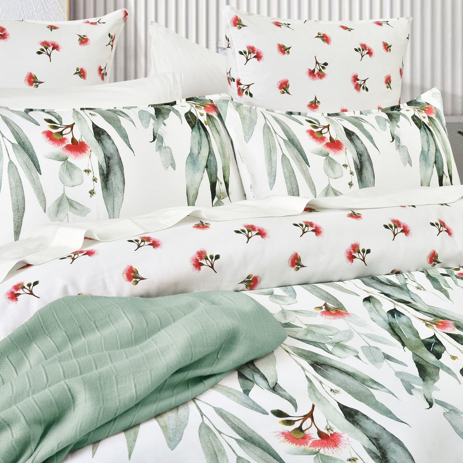 Kids quilt cover set close-up, mint reversible fabric with green eucalyptus leaf print