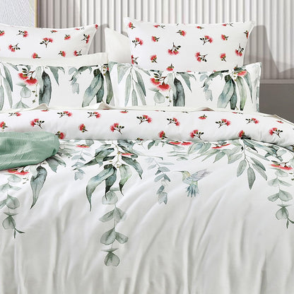 Kids quilt cover set on bed, birds-and-flowers top with green leaf print bottom