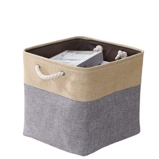 Square storage basket with beige rim and gray fabric body, rope handle