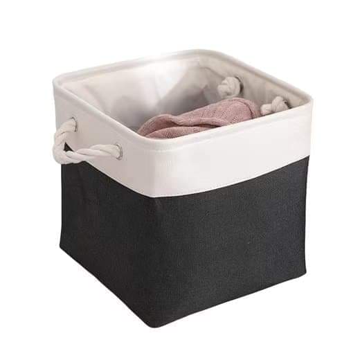 Two-tone fabric storage basket cube with rope handles, white and dark gray sides.