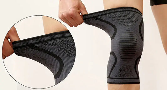 Black knee compression sleeve with dark gray contour pattern