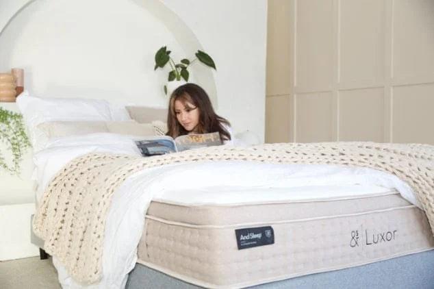 White quilted mattress with & Luxor label on the side, read-and-rest scene