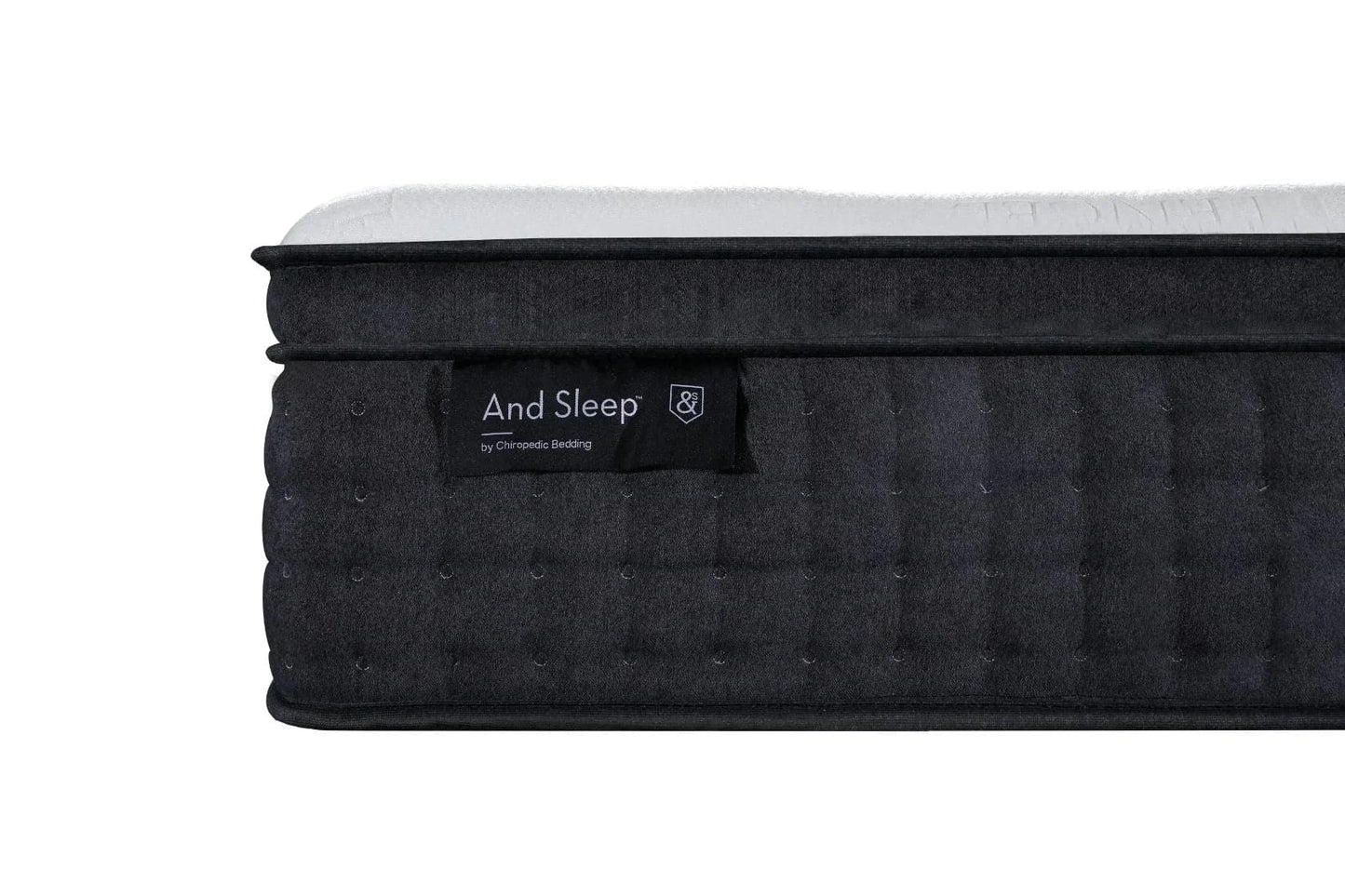 Black mattress with quilted side texture and label, white top edge visible