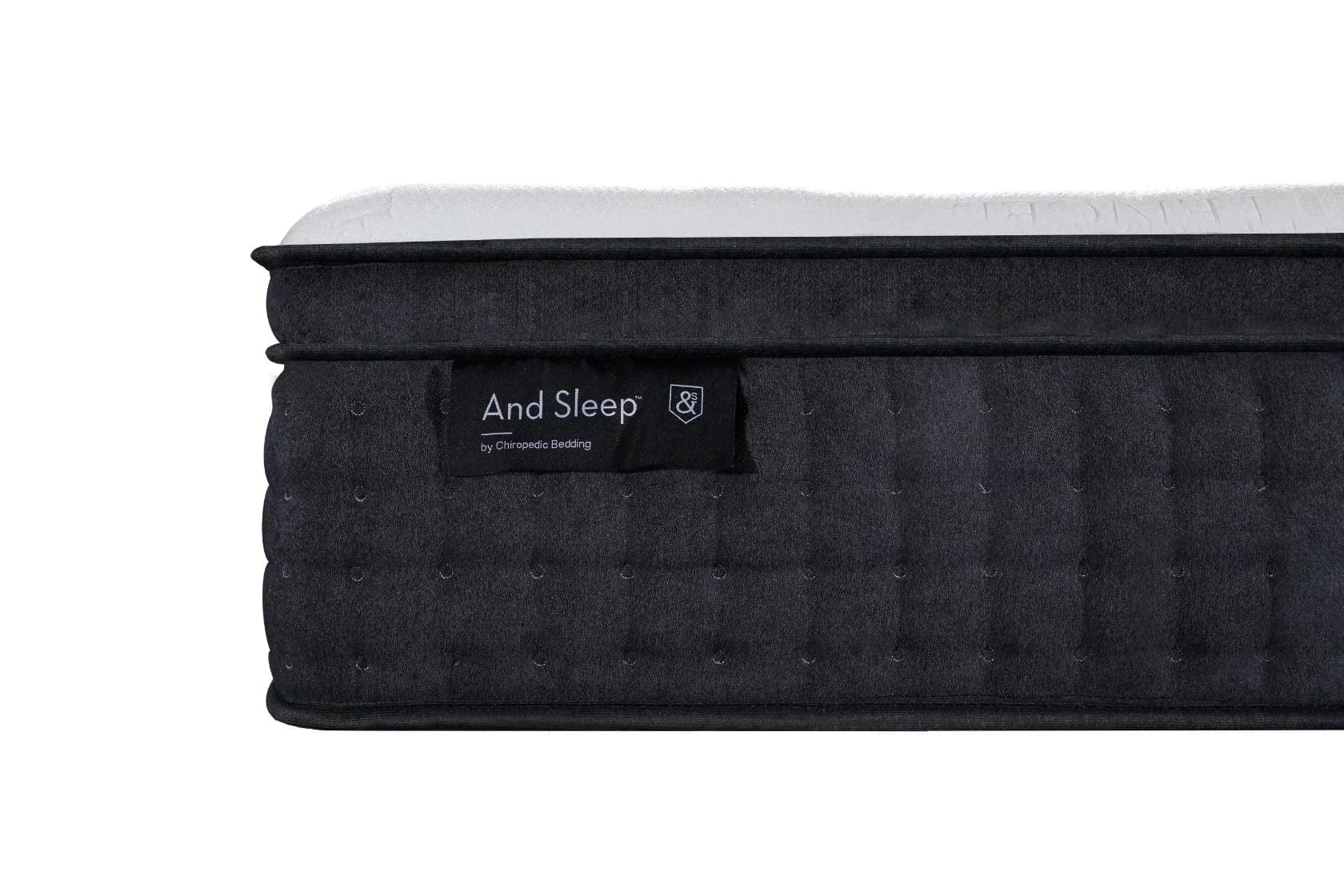 Black mattress with quilted side texture and label, white top edge visible