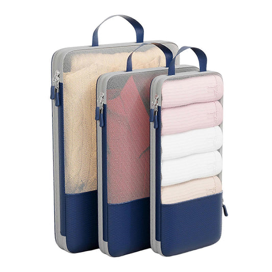Compression packing cube set, three zippered fabric bags with handles in blue, sand, pink