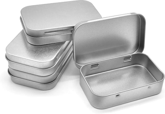 Four silver metal tins with hinged lids, open and stacked for compact storage