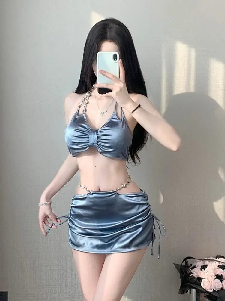Women’s silver satin bikini set with ruched triangle bra top and drawstring mini skirt
